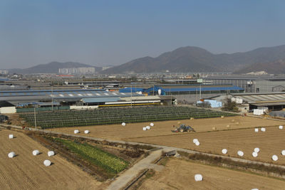 High angle view of landscape against blue sky