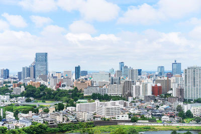 Buildings in city against sky