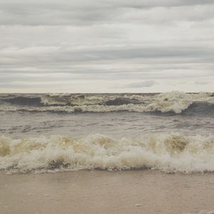 Scenic view of sea against cloudy sky