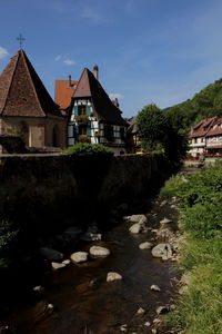 Houses in city against sky