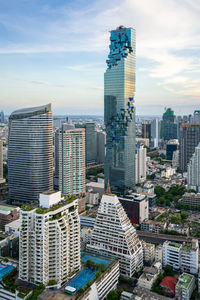 High angle view of buildings in city against sky