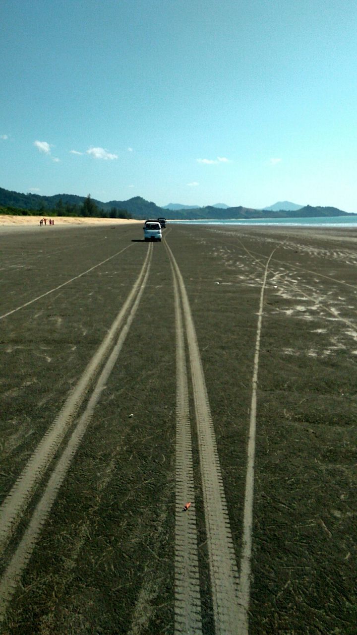 transportation, the way forward, road, landscape, road marking, diminishing perspective, sky, vanishing point, land vehicle, mode of transport, country road, clear sky, field, horizon over land, day, blue, car, outdoors, copy space, empty