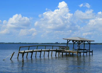 Pier on sea against sky