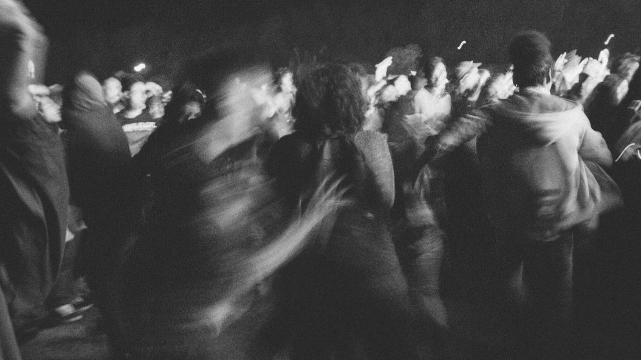 CLOSE-UP OF HANDS ON CURTAIN