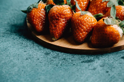 Close-up of strawberries in plate on table