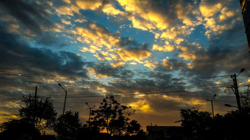 Low angle view of dramatic sky at sunset