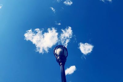 Street light against blue sky