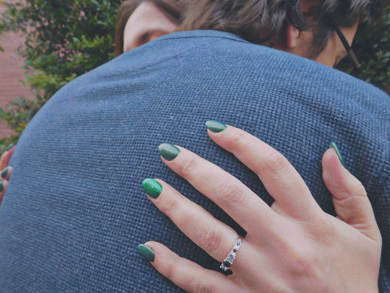 CLOSE-UP OF WOMAN HAND WITH BLUE EYES