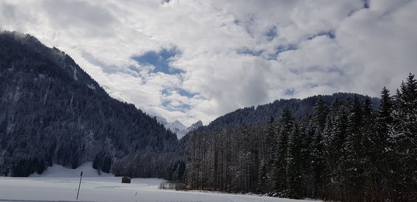 Scenic view of snowcapped mountains against sky