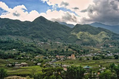 Scenic view of landscape and mountains against sky