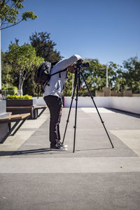 Person taken with tripod, concrete floor, sunny day