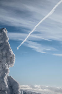 Low angle view of vapor trails in sky