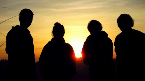 Tourists looking at sunset