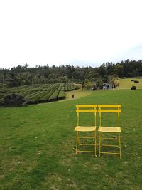 Scenic view of green landscape against sky