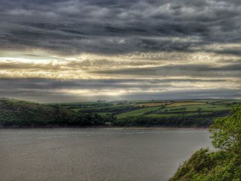 Scenic view of landscape against cloudy sky