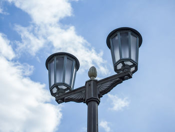 Low angle view of street light against sky