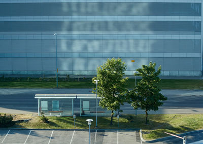 High angle view of trees against modern building