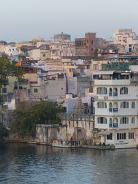 Buildings in city over lake in india