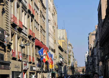 Panoramic view of city street against clear sky