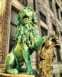 Low angle view of statue against building