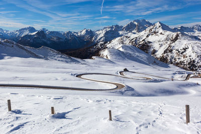 Scenic view of snow covered mountains against sky