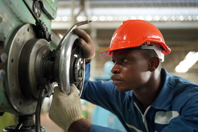 Close-up of man working in factory