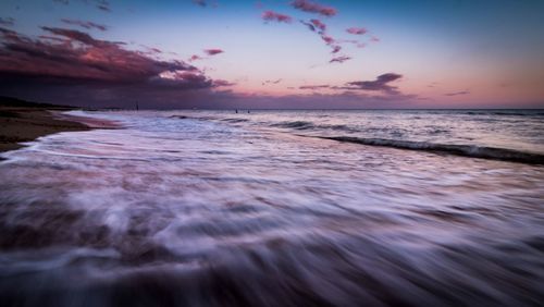 Scenic view of sea at sunset