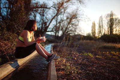 Woman sitting on field