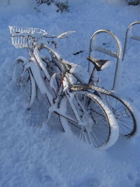 High angle view of bicycles on snow covered field