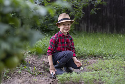 Portrait of man standing on field