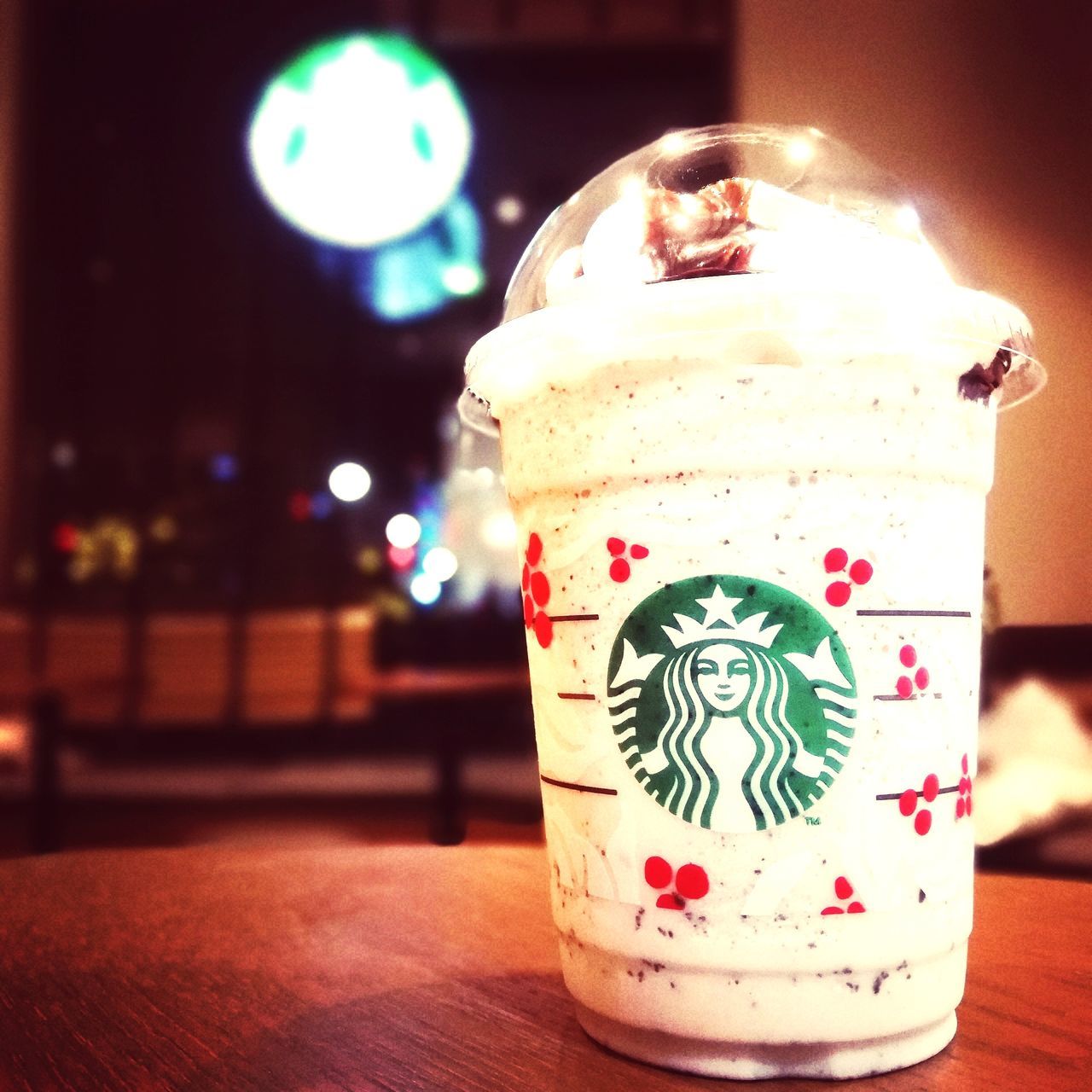 CLOSE-UP OF ILLUMINATED DRINK ON TABLE