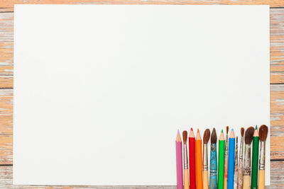 Close-up of multi colored pencils against white background