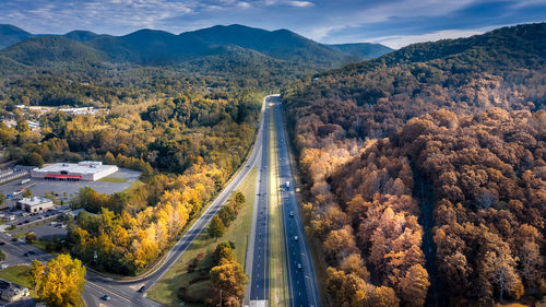 High angle view of road amidst trees during autumn