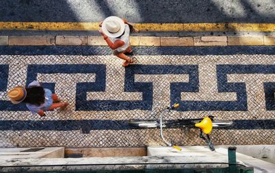 High angle view of man walking on road