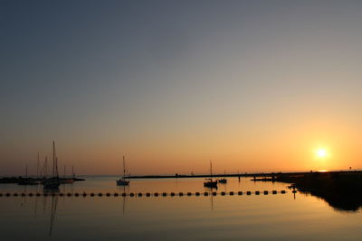 Silhouette of marina at sunset