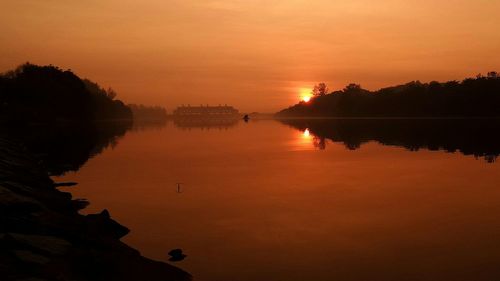 Scenic view of lake at sunset