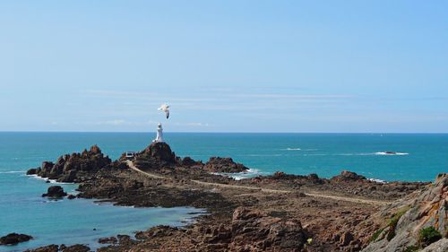 Scenic view of calm sea against sky