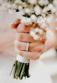 Cropped hand of woman holding dental equipment