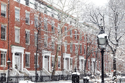 Street amidst buildings during winter