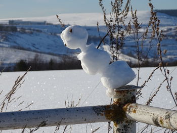 Snowman on a lake