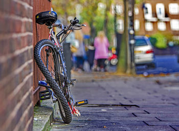 Close-up of bicycle on city