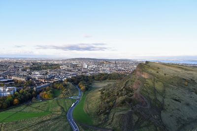 High angle view of road amidst buildings against sky