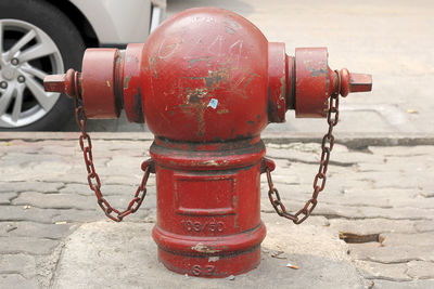 Close-up of fire hydrant on street in city