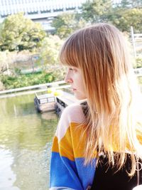 Young woman looking at lake