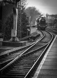 Train on railroad tracks against sky