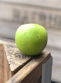 Close-up of apple on wooden table