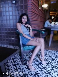 Portrait of woman sitting on seat