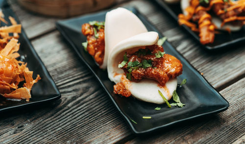 Close-up of serving food in plate on table