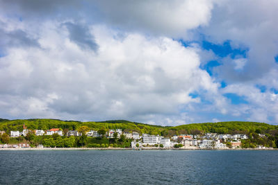 Scenic view of sea and buildings against sky