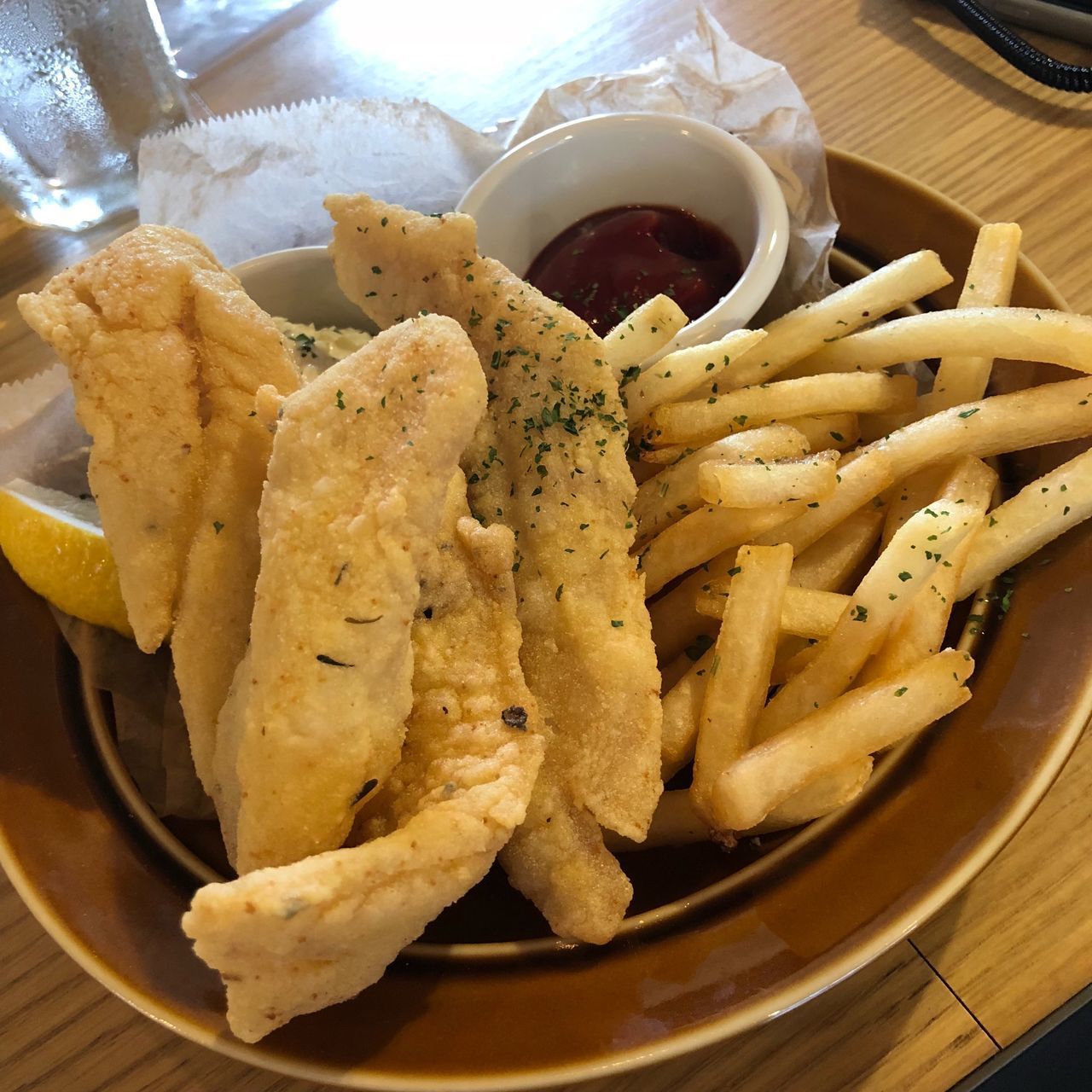 CLOSE-UP OF BURGER AND FRIES IN PLATE